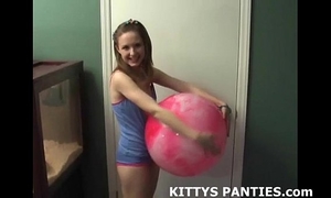 Innocent legal age teenager kitty playing softball outdoors