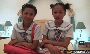 Two oriental non-professional girls sharing a white schlong