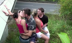 Cum on a chunky BBC slut with large melons in extraordinary public foursome sex by a highway